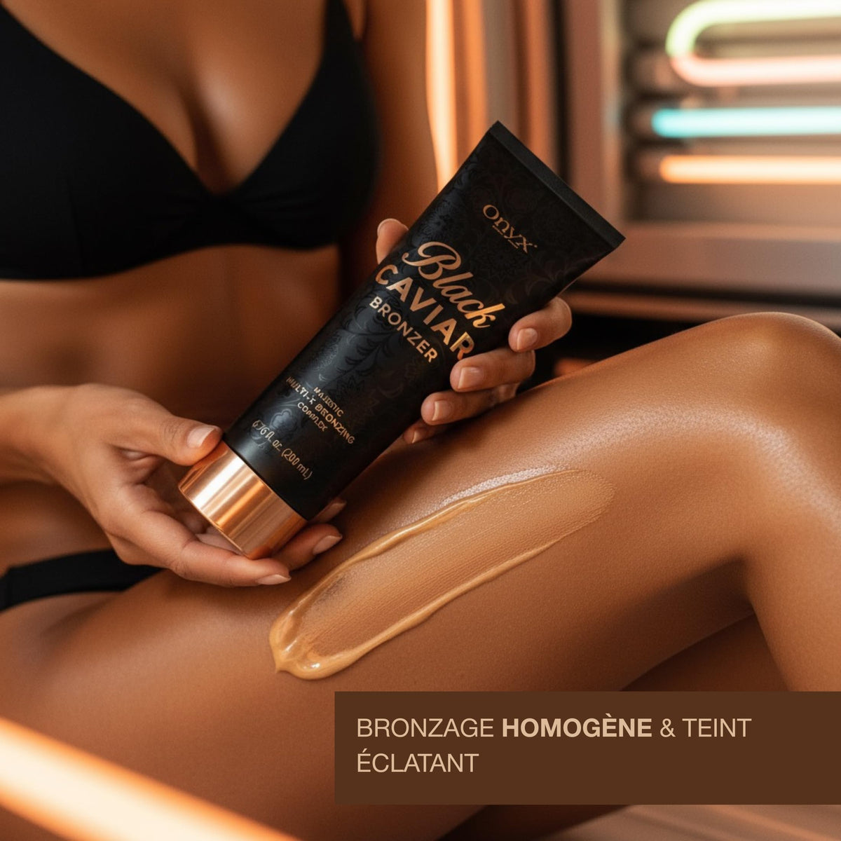 Onyx in tanning room lifestyle shot conveying fast, dark tan results