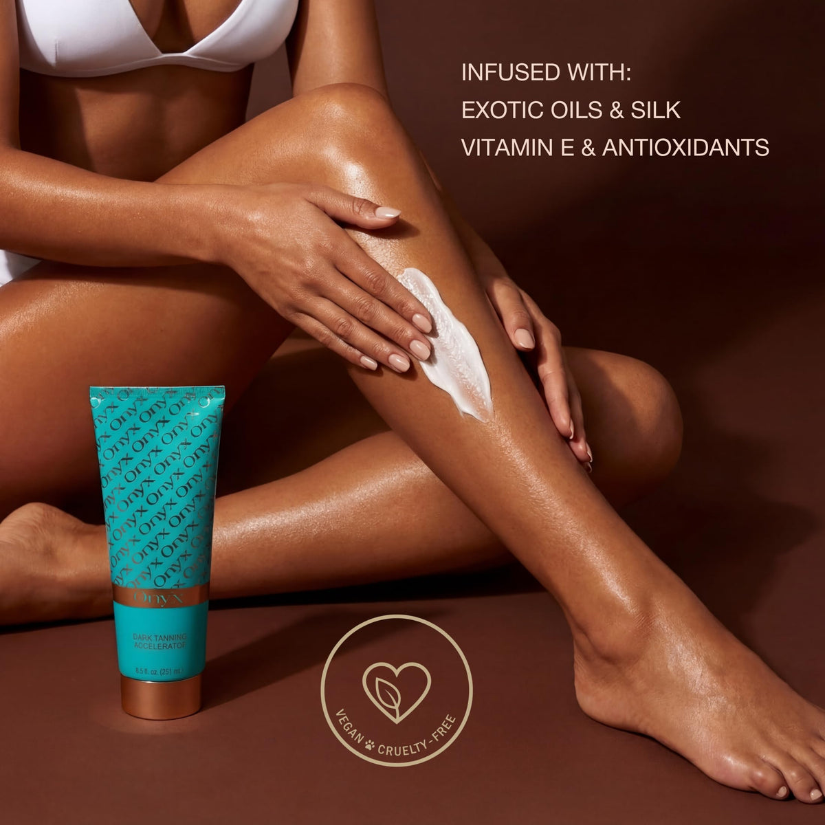 Onyx bottle by towel and sunglasses on beach showing outdoor tanning use