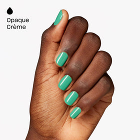 OPI painted nails on hand wearing Big Apple Green demonstrating even opacity