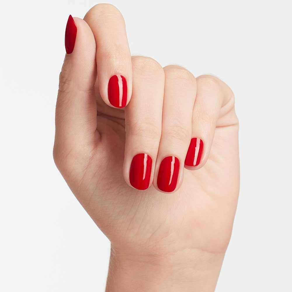 OPI Big Apple Red application in use showing fast dip technique and neat results