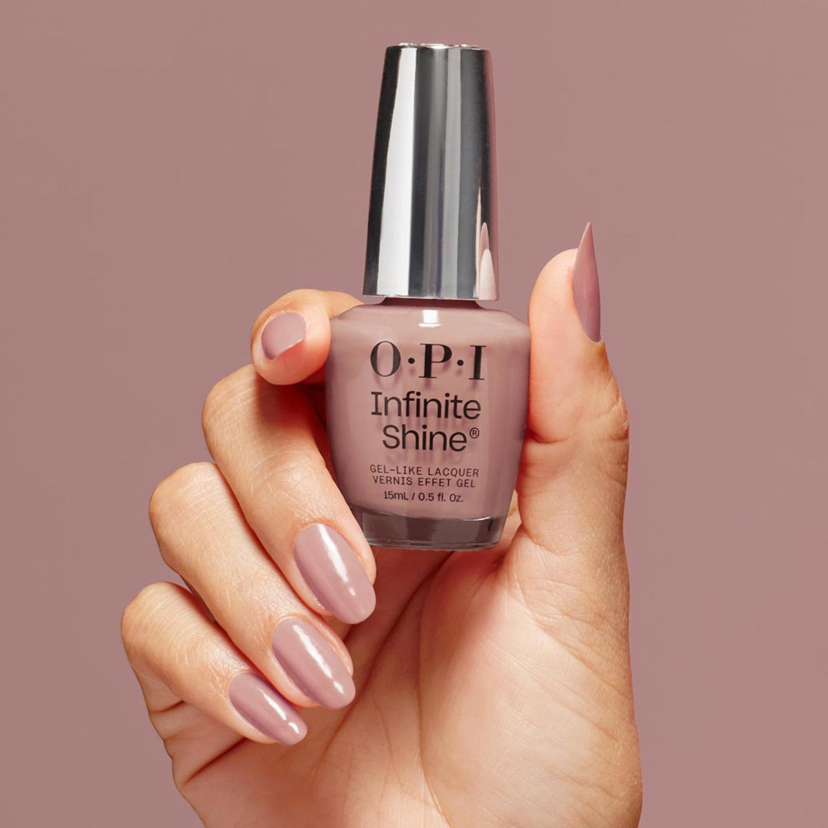 OPI Dulce de Leche bottle in hand for scale showing travel-friendly, professional benefit