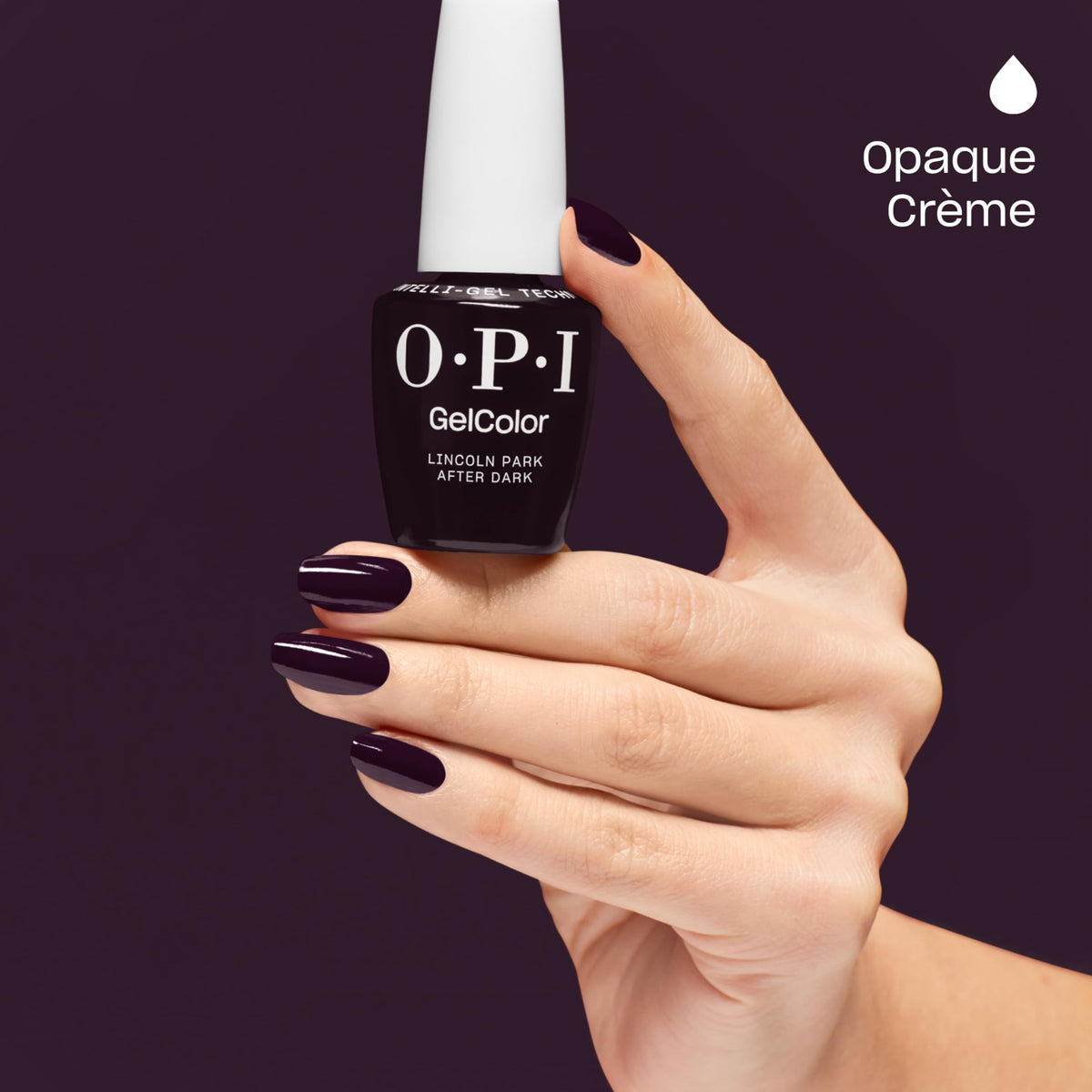 Nails curing under LED lamp with OPI Lincoln Park After Dark for fast, smudge-free finish