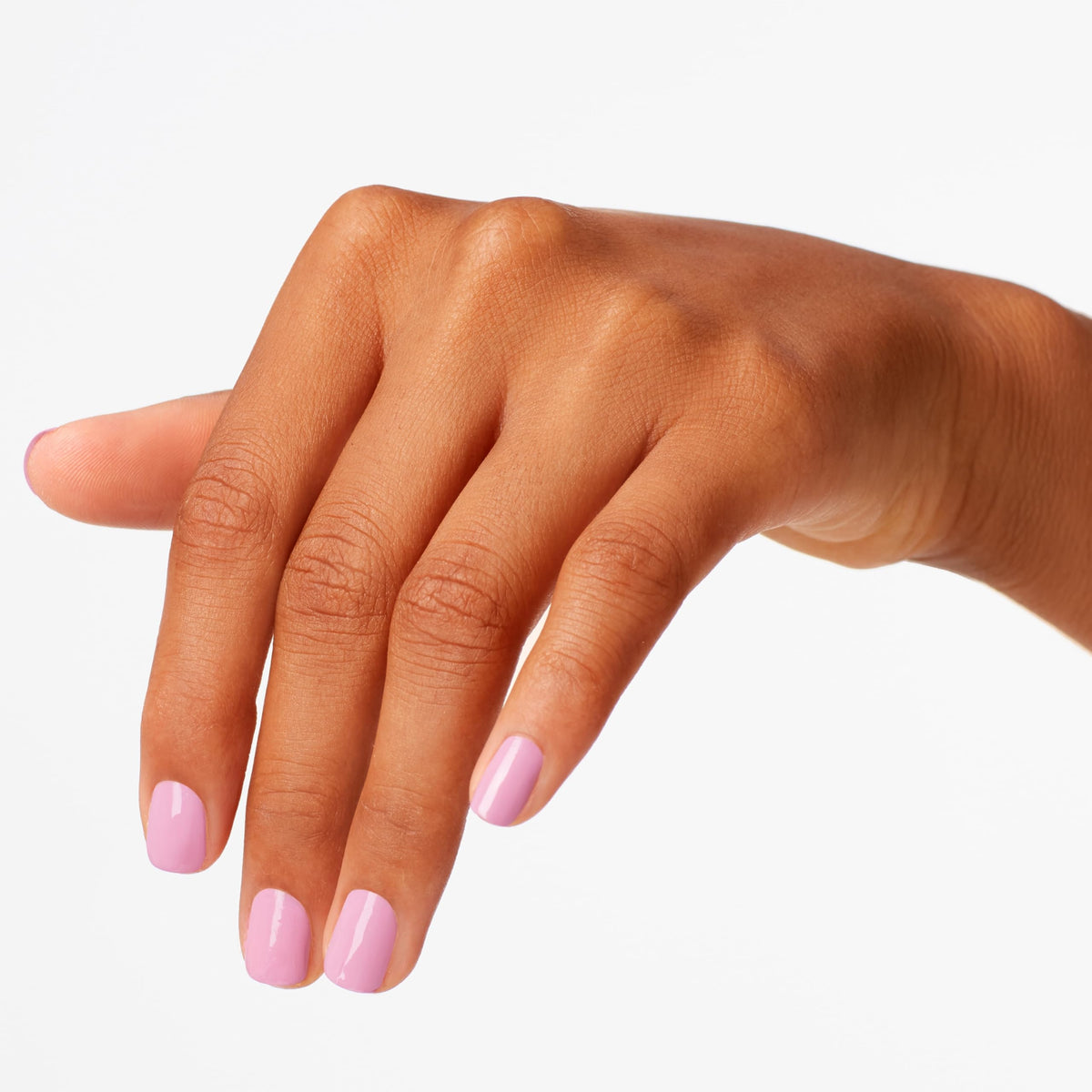 Nails curing under LED lamp with OPI brand for fast 30-second smudge-proof finish