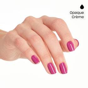 OPI swatch on fingertips illustrating opaque magenta finish and shine