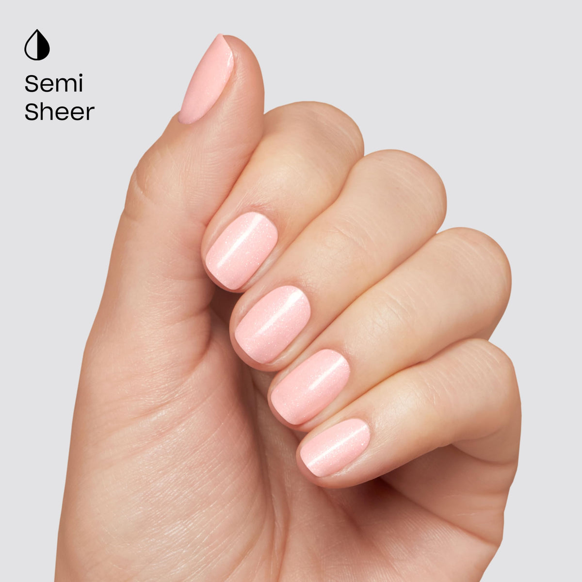 Hands wearing Glazed Donut on natural nails showing wearable pink elegance benefit