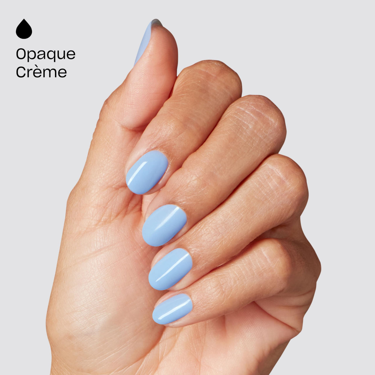Hand wearing Shake Your Blue-ty showing salon-quality light blue finish