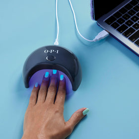 OPI GELement base coat on a manicure table with tools showing salon-quality DIY readiness