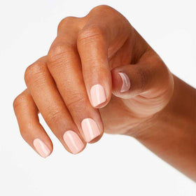 OPI painted nails in lifestyle setting showing wearable nude elegance