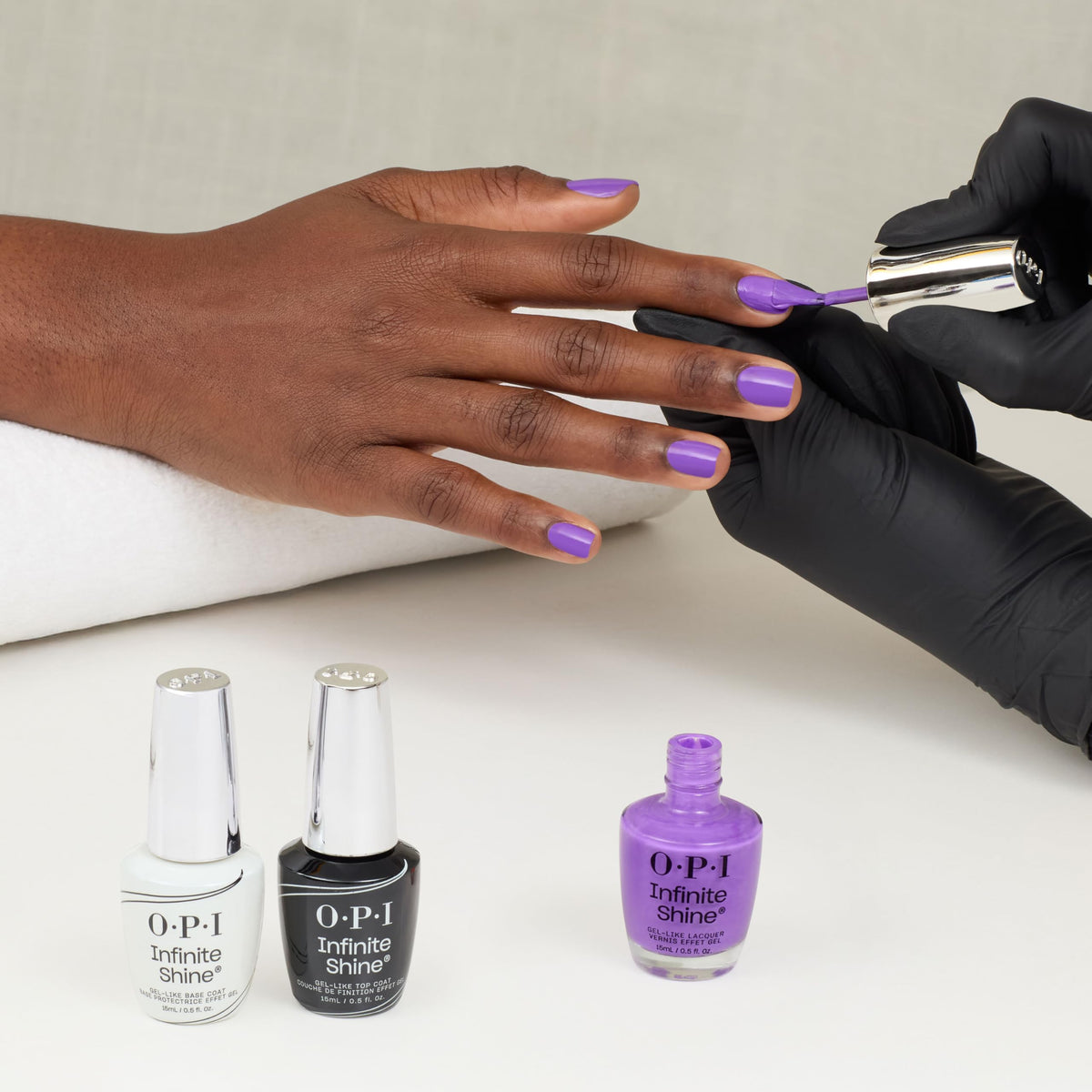 OPI finished manicure in lifestyle setting showing long-lasting, vibrant color