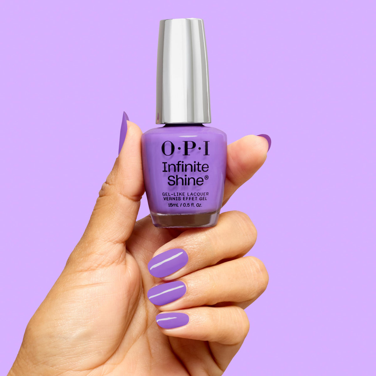 OPI nail being painted with Here Plums the Sun showing salon-like results