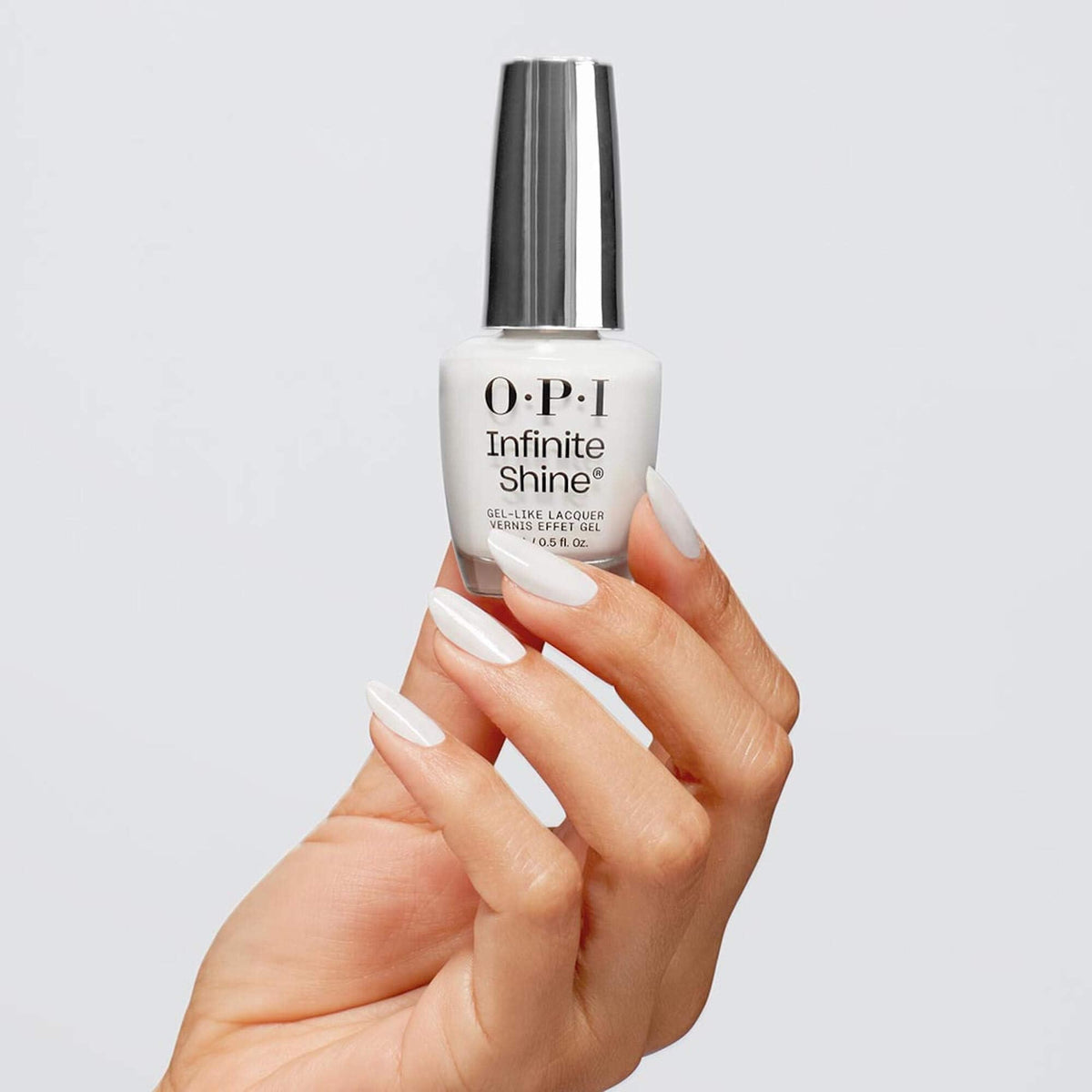 OPI brush close-up applying Alpine Snow showing smooth streak-free coverage