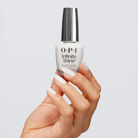 OPI brush close-up applying Alpine Snow showing smooth streak-free coverage