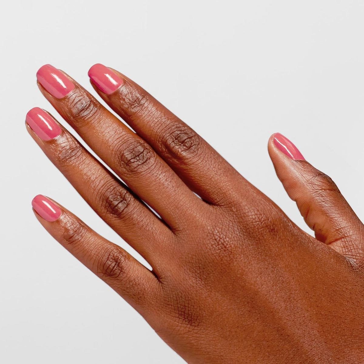 OPI swatch on nail tips showing true opaque pink coverage and salon look benefit