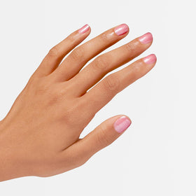 OPI color applied on nails demonstrating buildable sheer coverage
