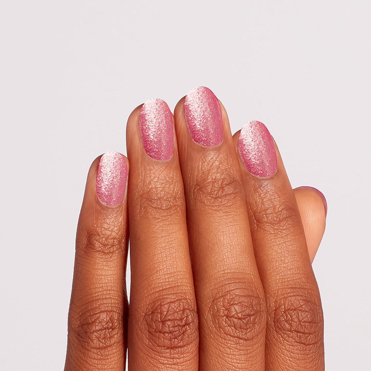 OPI painted nails in sunlight showing long-lasting gel-like glossy wear