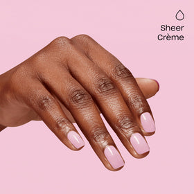 Manicurist curing OPI It's a Girl on nails for long-wear benefit