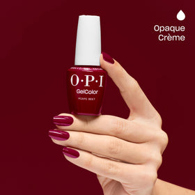 OPI Miami Beet being applied to a nail with smooth self-leveling formula visible