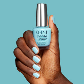 OPI bottle held in hand for scale showing compact size and easy handling