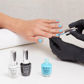 OPI bottle on a beach towel lifestyle shot conveying surf-inspired color vibe