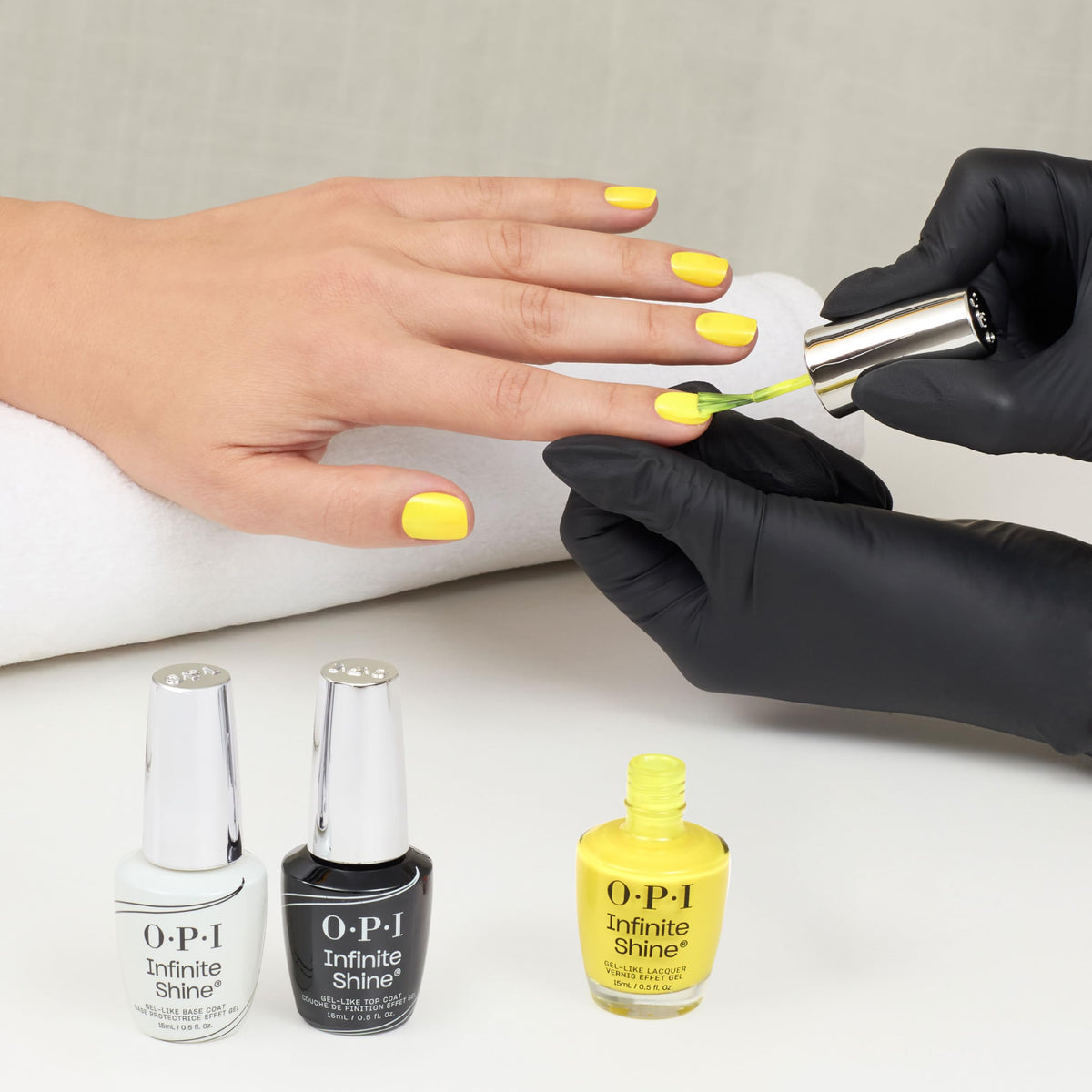 OPI bottle placed on beach towel lifestyle shot showing summer-ready color and cheerful style benefit