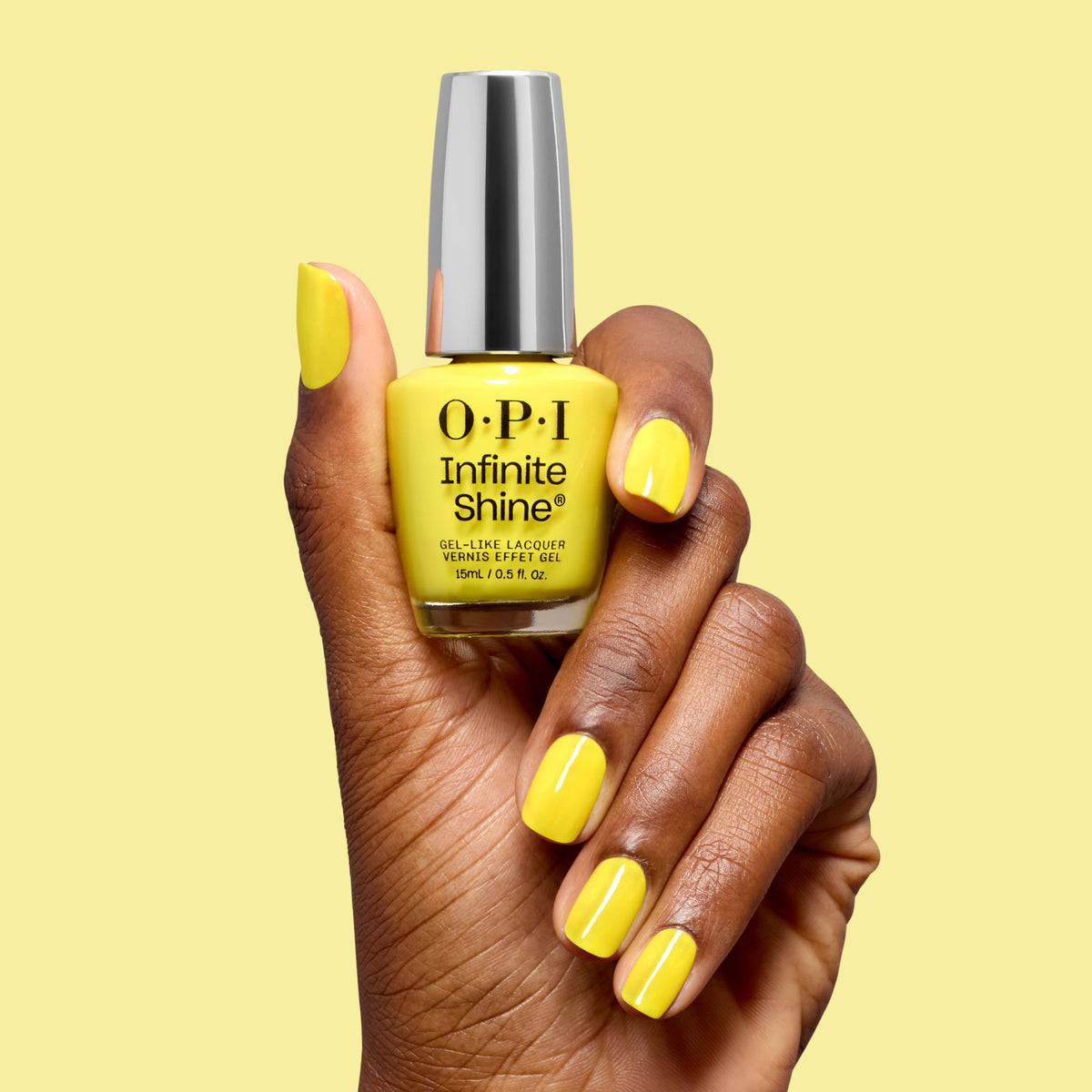 OPI closeup of nails painted Sunkissed and Tell showing gel-like shine and chip resistance benefit