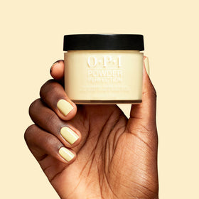 OPI Sunny Bunny technician dipping nail into powder during application for faster service