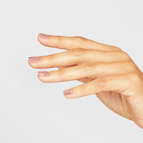 OPI application in salon showing dipping process for durable wear