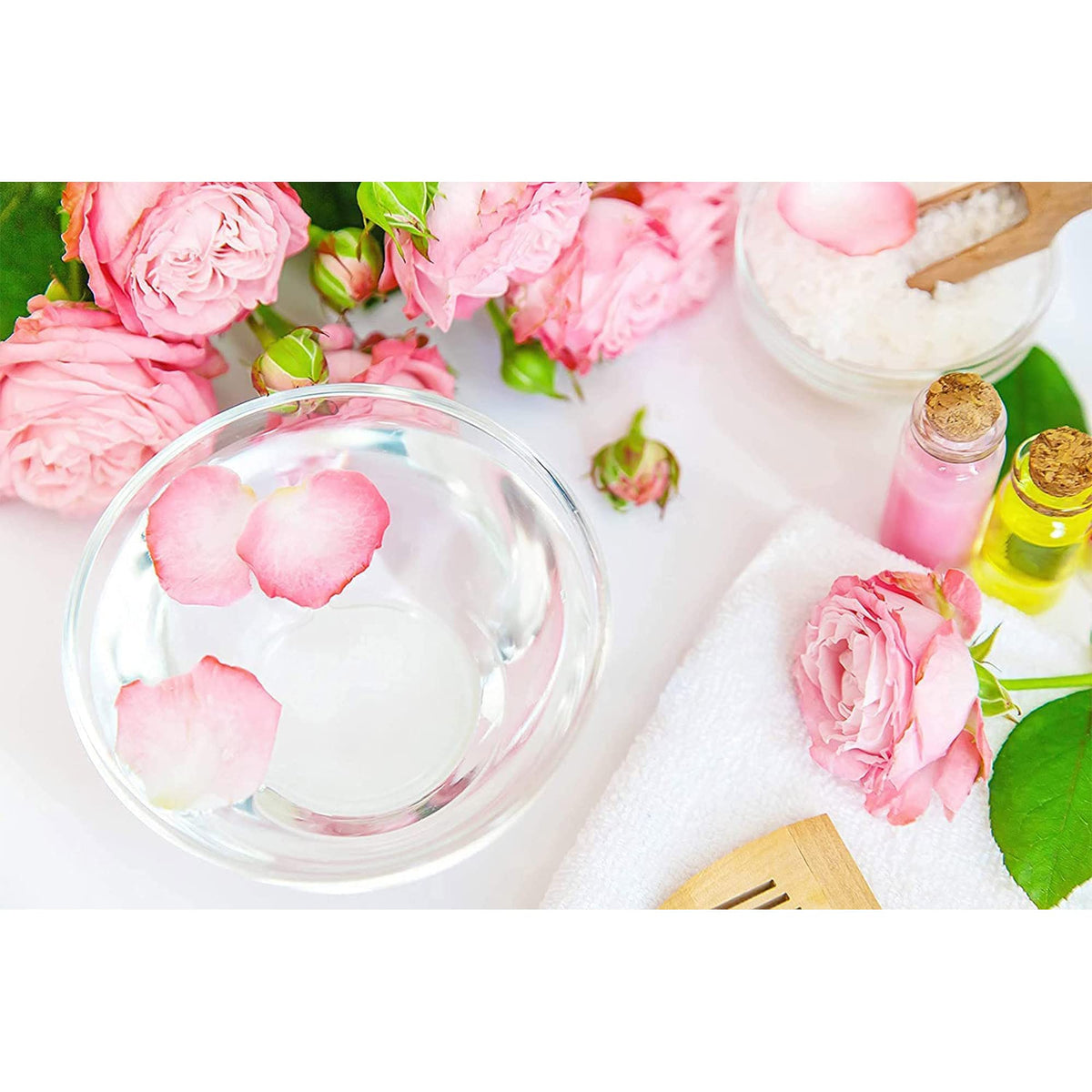 OPO spritzing rose hydrosol on hair to refresh curls and add light hydration