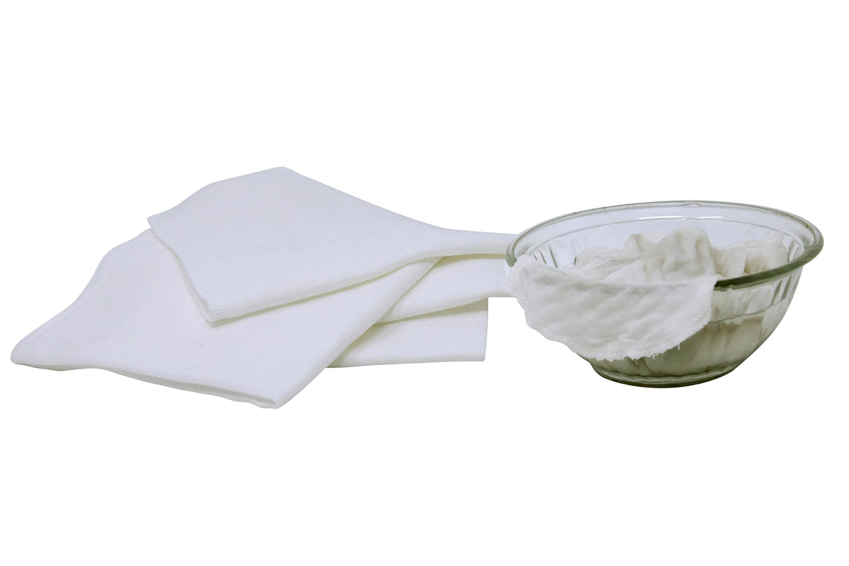 Organic Cotton Mart folded stack in bathroom lifestyle promoting sustainable routine