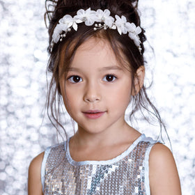 Oriamour worn by flower girl outdoors adding soft charm and photogenic sparkle