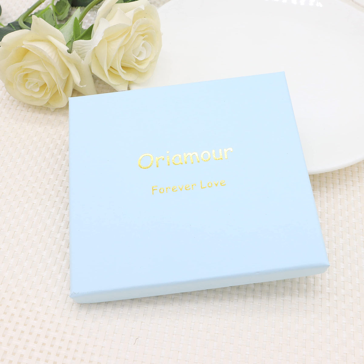 Oriamour styled on wedding table setting suggesting coordination with bridal accessories