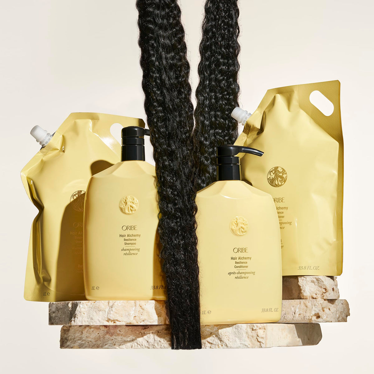 ORIBE before and after hair shot illustrating reduced breakage benefit