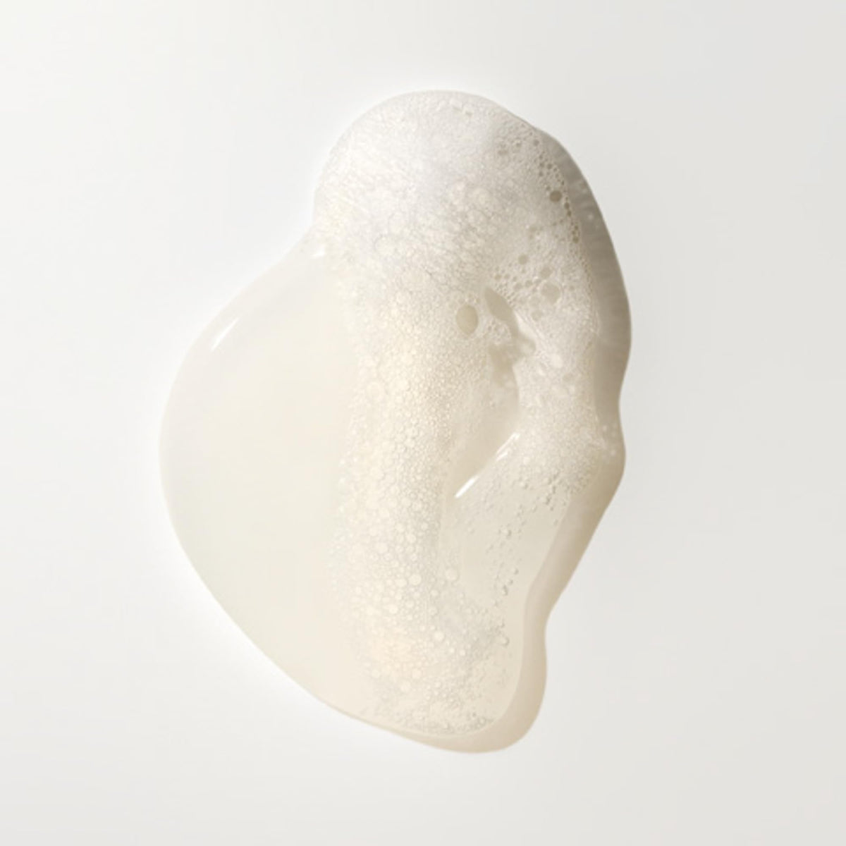 ORIBE bottle beside conditioner illustrating system use benefits