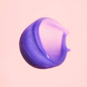 ORIBE serum texture on hand showing lightweight blend and hydration