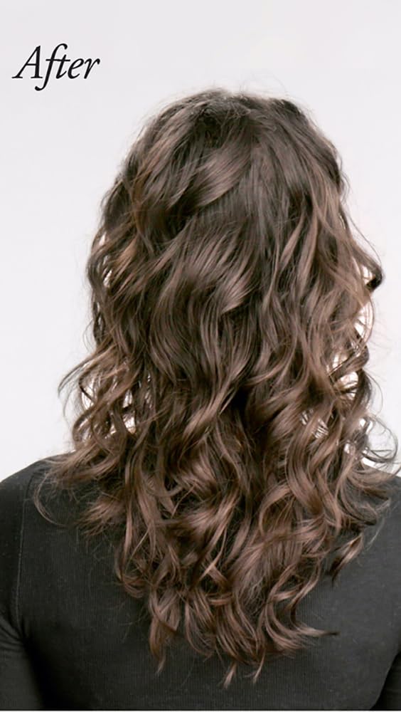 Oribe conditioner poured onto hand demonstrating detangling benefit