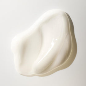 Oribe conditioner creamy texture close-up showing rich hydration and smooth slip
