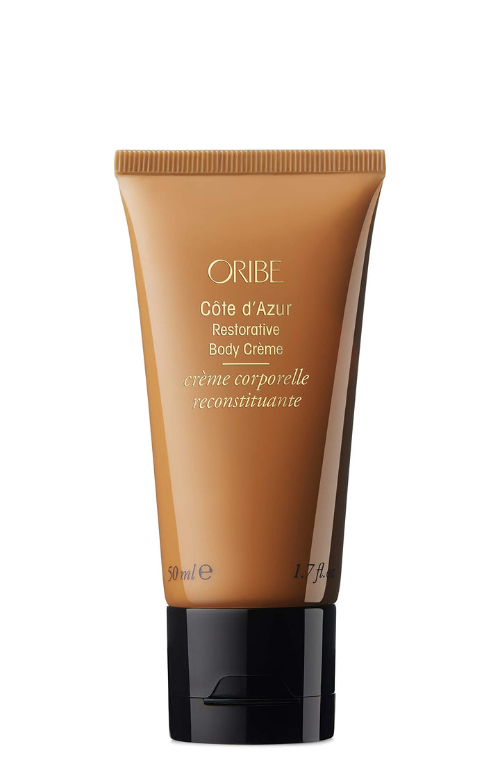 Oribe travel body cream front packaging showing 1.7oz size and luxury branding, convenient for travel