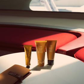 Oribe Cote d'Azur foam closeup on hand highlighting silky texture and moisturizing effect