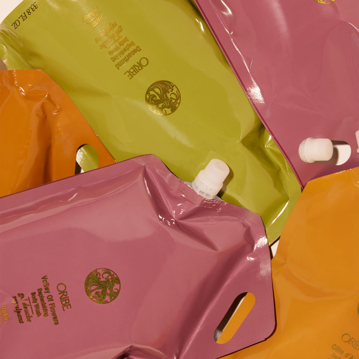 ORIBE scent notes visual showing bergamot, jasmine, and sandalwood