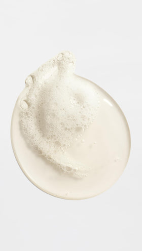 ORIBE body wash in shower scene creating lather and evoking spa-like benefit