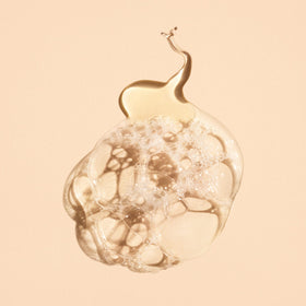 Oribe hand wash by sink styled with towel, suggests elegant daily ritual