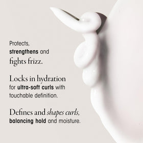 ORIBE dispensing product from jar to show lightweight application benefit