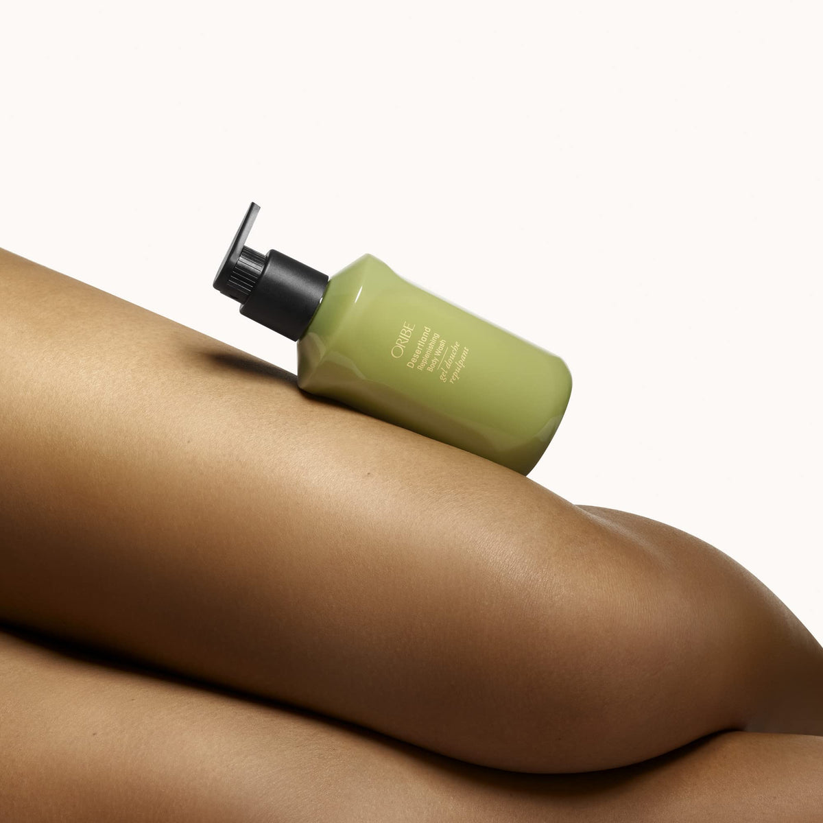 ORIBE creamy lather on hand demonstrating gentle, softening cleanse