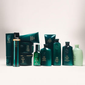Oribe Eternal Curls jar in shower setting indicating salon-quality at-home treatment