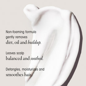 ORIBE dispensing cleansing cream from bottle for easy application