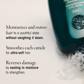 Oribe eternal curls shampoo applied to wet curly hair in hand for improved manageability
