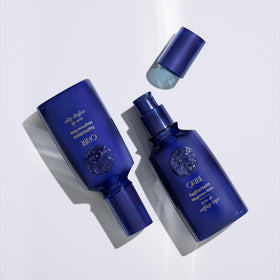 Oribe Featherbalm beside a common object to show 3.4 oz scale for purchase clarity