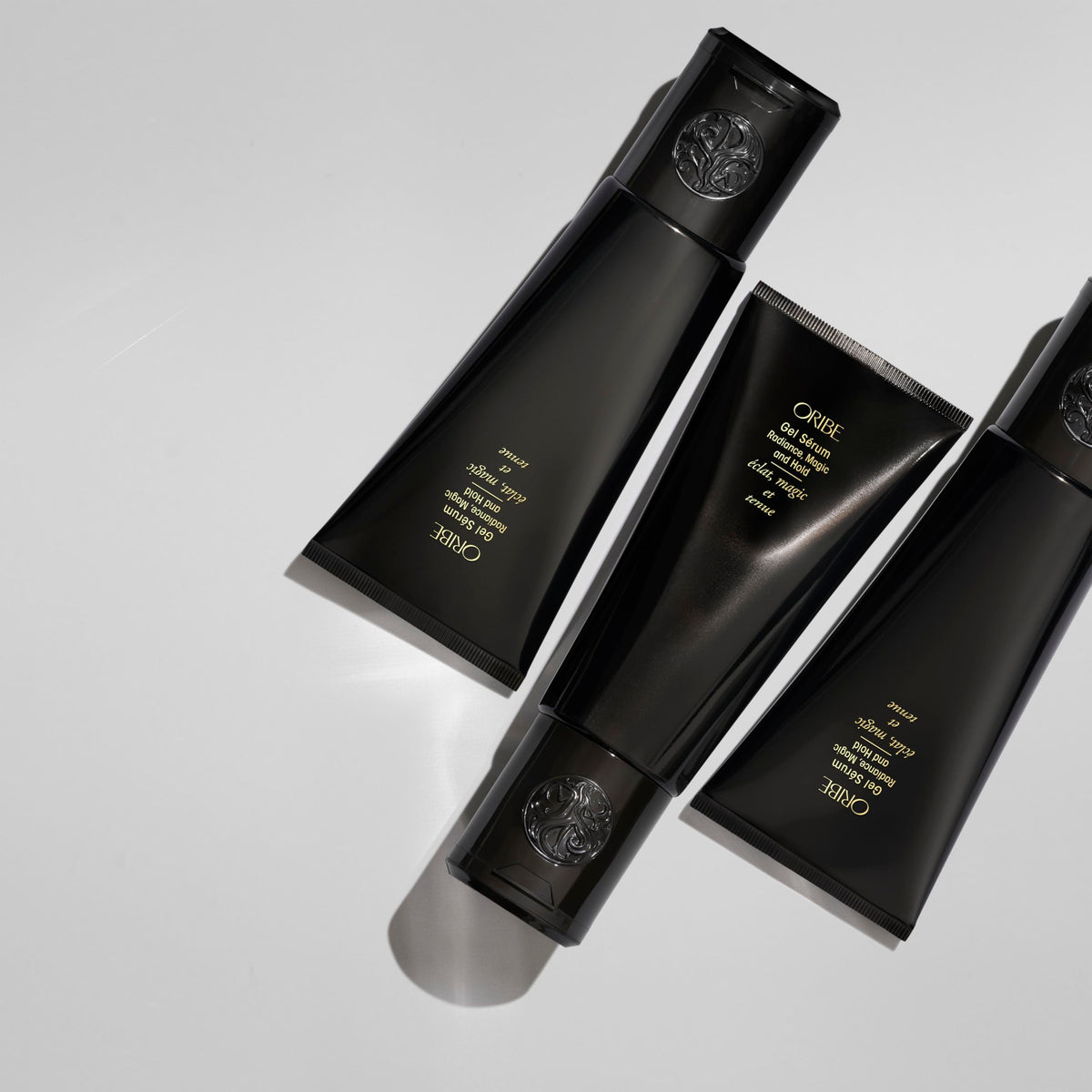 Oribe label close-up highlighting key ingredients aloe vera and cherry bark benefit