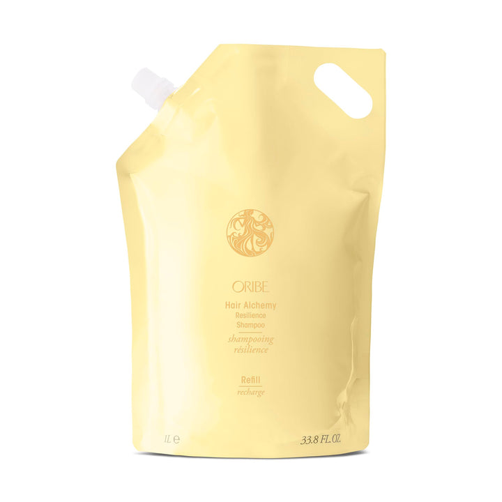 Oribe front packaging of Hair Alchemy Strengthening Shampoo showing liter refill benefits