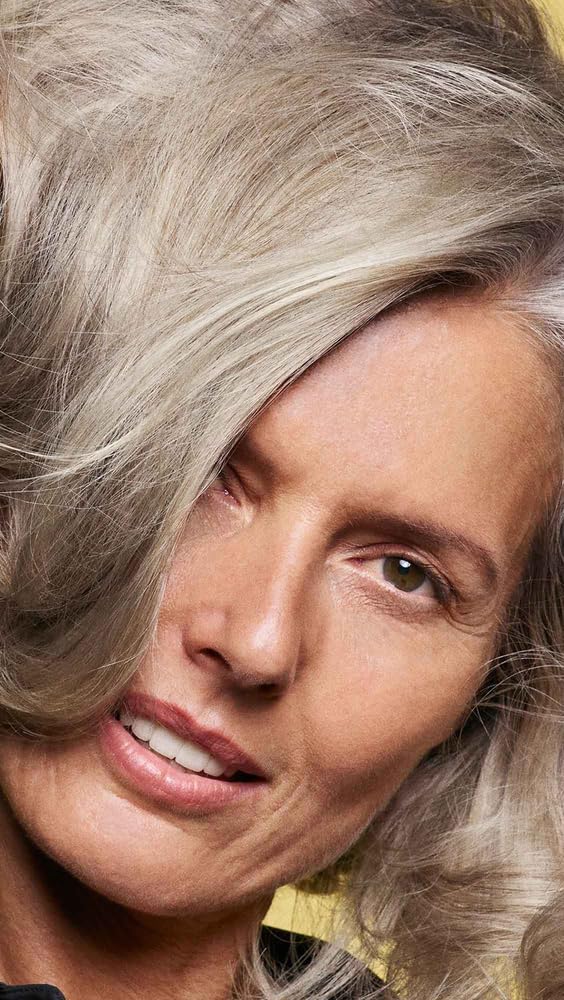 Oribe Hair Alchemy staged on bathroom vanity illustrating luxe lifestyle appeal